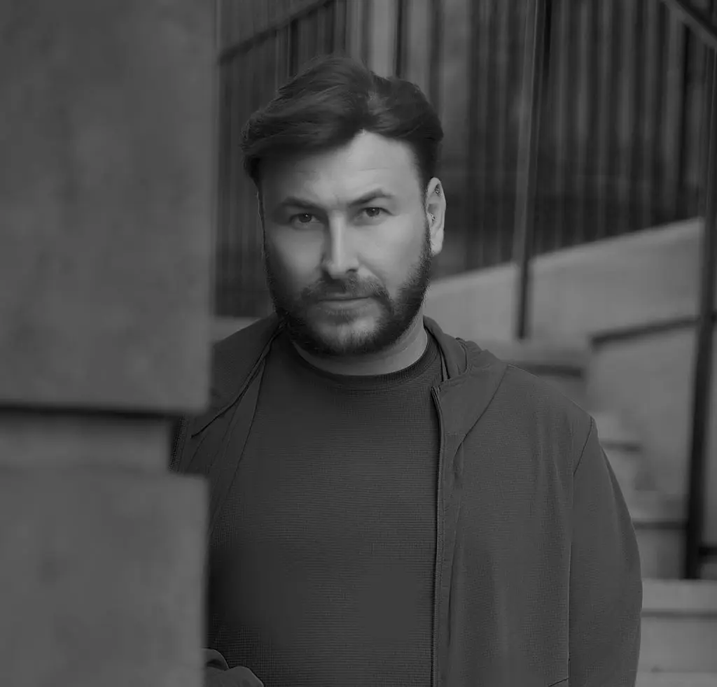 Black and white natural light portrait of a bearded man outside a Liverpool building