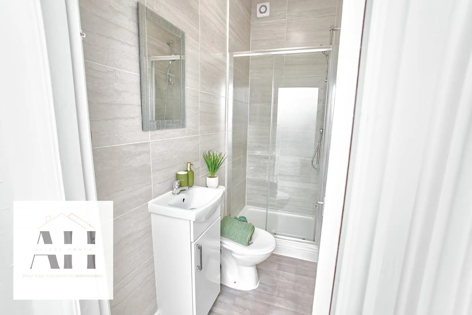 Compact bathroom with shower photographed for a Liverpool property listing