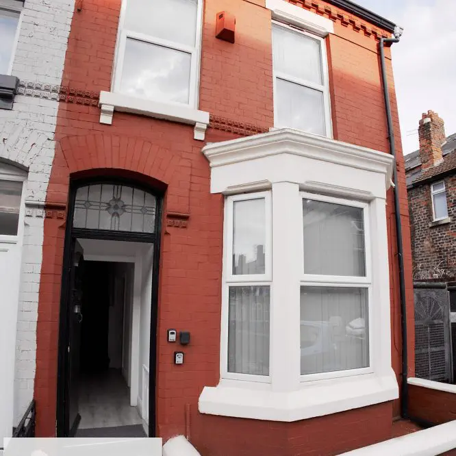 Red brick terraced house exterior photographed for a Liverpool property listing
