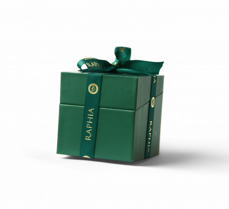 E-commerce product photography of a green Raphia chocolate gift box with a ribbon, Liverpool