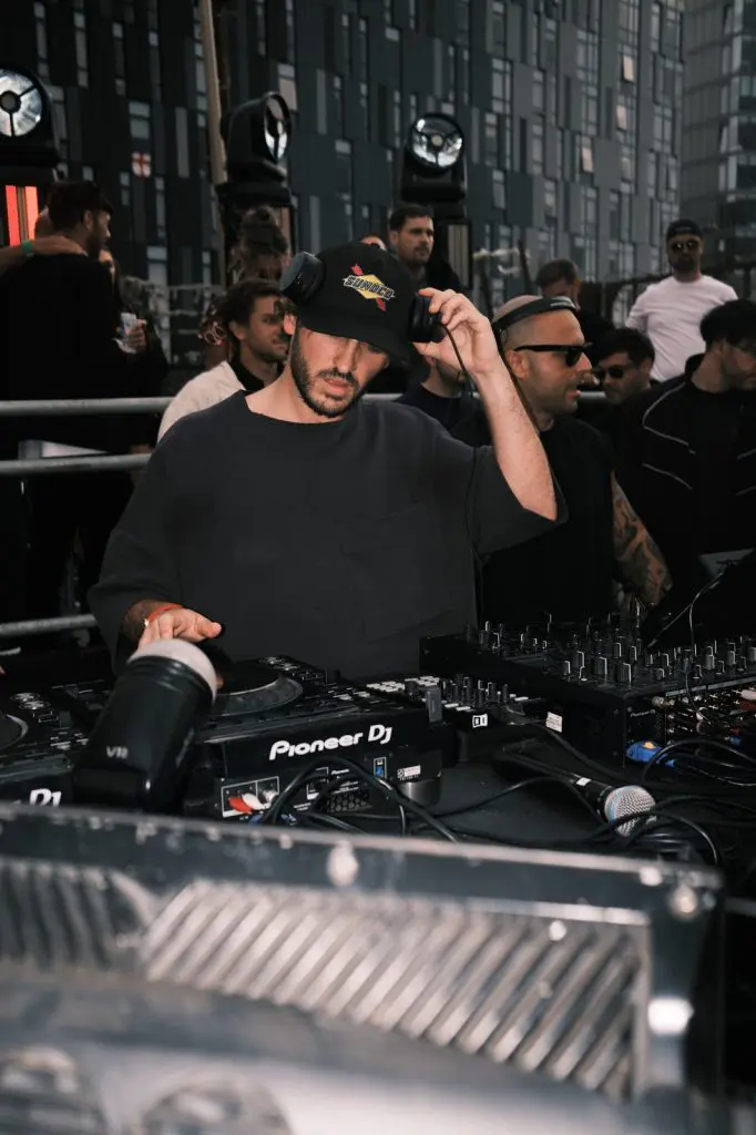 DJ working the Pioneer decks at an open air event in the Baltic Triangle, Liverpool