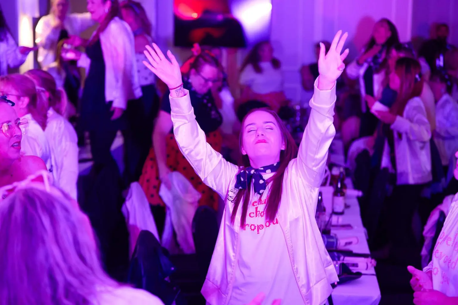 Guest with arms raised and eyes closed, lost in the music at The Incredible Brunch, a bottomless brunch event in Liverpool photographed by Captured By Luke Media
