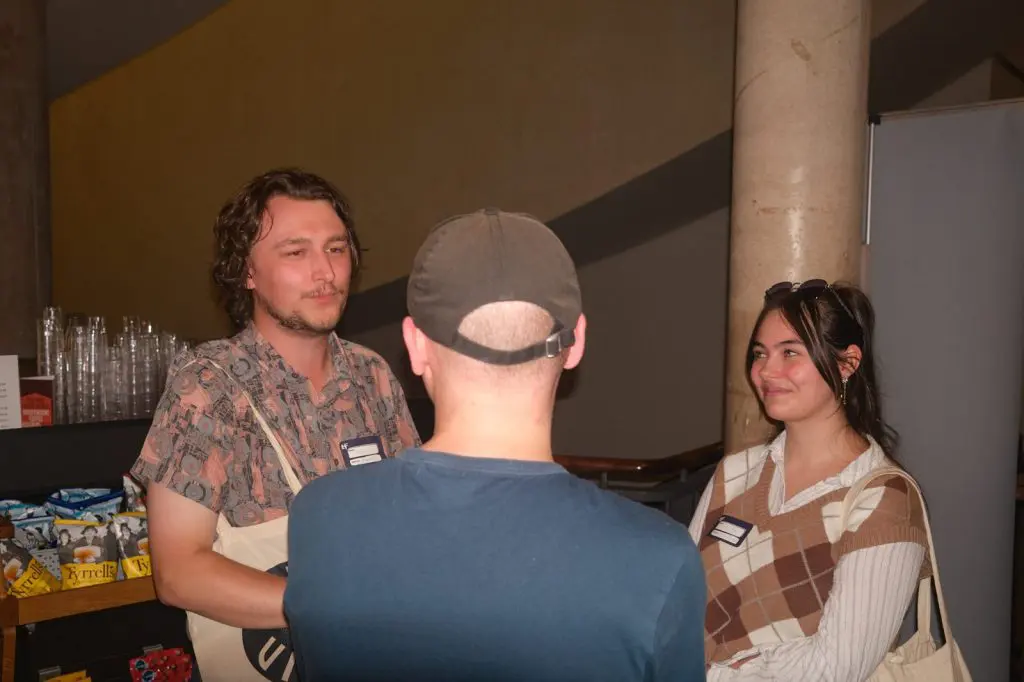 Guests wearing name badges chatting at a Creative Mixer social networking event in Liverpool, event photography
