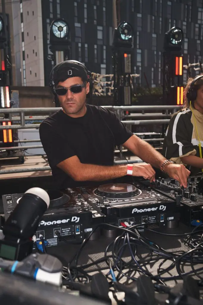 DJ Huzey photographed mid set at COCO Open Air in Liverpool