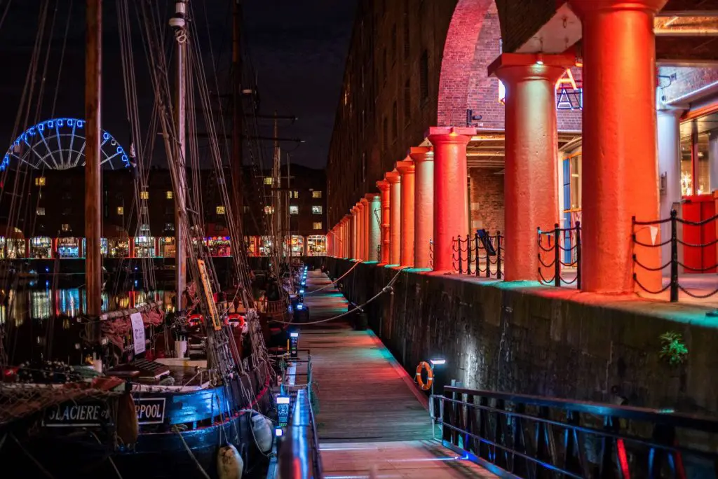 The Royal Albert Dock colonnade lit up at night on the Liverpool waterfront