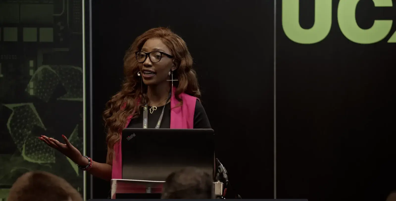 Speaker presenting at a lectern during a conference, filmed in Liverpool by Captured By Luke Media