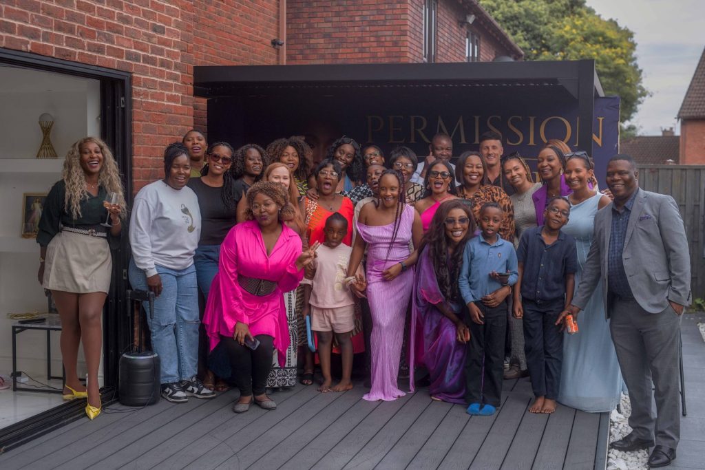 Large group photo of guests on the terrace at the Permission to Prosper book launch in Liverpool, event photography by Captured By Luke Media